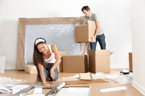 Removal team in Waterloo handling boxes during a residential move