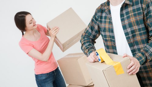 Removal team handling household items during a scheduled move