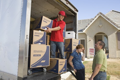 Packed boxes and household items ready for loading into a van