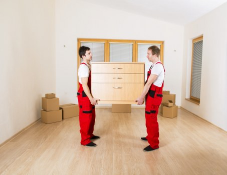 Professional movers handling a flat move in Waterloo apartment building